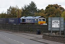 Direct Rail Services Class 66 No.66414 in Stobart Rail livery leaves Aviemore with 4N47 Inverness - Grangemouth intermodal service 66414 Aviemore.jpg