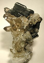 Allanite crystals on smoky quartz from the White Mountain Wilderness, Lincoln County, New Mexico, USA (size: 2.7 x 1.8 x 1.7 cm) Allanite-Quartz-39466.jpg