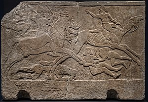 Relief from Tiglath-Pileser's palace in Nimrud depicting Assyrian riders pursuing a camel rider Assyrian Relief depicting Battle with Camel Rider from Kalhu (Nimrud) Central Palace Tiglath pileser III 728 BCE British Museum AG.jpg