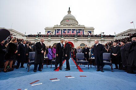 Obama talks with Biden during the inaugural swearing-in ceremony.