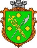 Vert bordure or, a caduceus or and an axe argent saltirewise, four octagrams or in chief, in base and in fess, and overall surmounted by a mural crown argent.