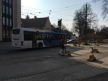 Bus on traffic circle (44659890645).jpg