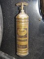 A brass, Pyrene carbon-tetrachloride, fire extinguisher.