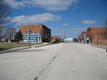 Downtown Chenoa, Illinois in mid-March 2007. The Historic Mural seen here has since been painted over after the new library was built. Chenoa Il downtown1.JPG