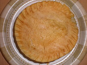 A cooked Marie Callender's chicken pot pie, ou...