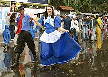 A couple wearing traditional gaucho costumes in the 2006 Farroupilha Week parade. Desfile da Semana Farroupilha.jpg