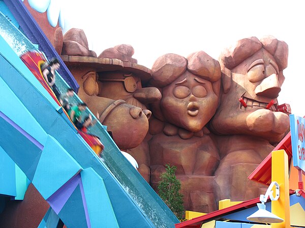 The Dudley-Do Right's Ripsaw Falls log flume ride features a parody of Mount Rushmore with (left to right) Horse, Fenwick, Nell, and Do-Right.