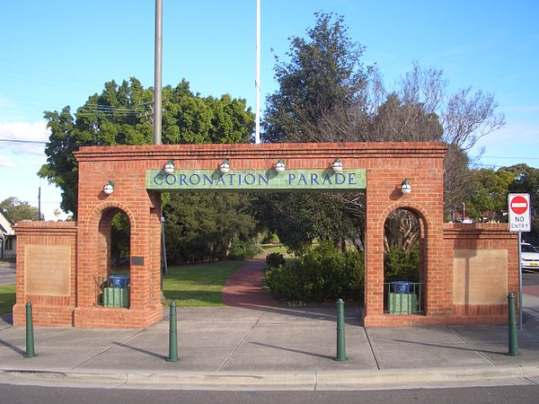 The Coronation Parade Arch, built in 1937 and now on the boundary between Enfield and Strathfield South, displays 4 light bulbs in sockets which were 