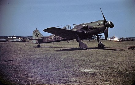 This captured Fw 190 D-9 appears to be a late production aircraft built by Fieseler at Kassel. It has a late style canopy; the horizontal black stripe with white outline shows that this was a II. Gruppe aircraft.