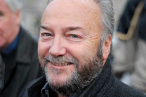 A balding man with a grey beard