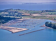 Gulf Harbour marina surrounded by farmland in the 1980s Gulf Harbour marina in the 1980s (cropped).jpg