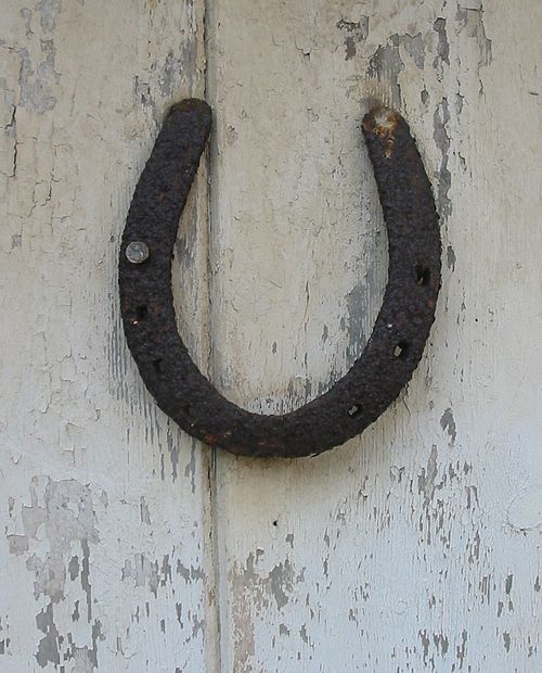 A horseshoe on a door is regarded a protective talisman in some cultures.