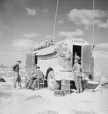 An AEC Armoured Command Vehicle in the desert. IWM-E-6867-AEC-Dorchester-19411201.jpg