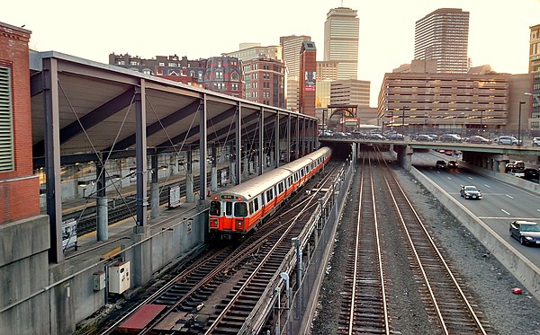 View of station from Berkeley Street overpass, looking westward. From left to right: Tracks 2, 1, 3; Orange Line tracks and train; Tracks 5 and 7.