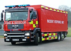 An Incident Response Unit operated by Norfolk Fire and Rescue Service with a blue lightbar on top, alternately flashing LED lights on the front, and flashing headlights. This vehicle is part of the New Dimension programme and consequently does not carry any insignia of Norfolk Fire and Rescue Service. Incident Response unit.JPG