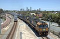 National Rail liveried NR90 leads the Indian Pacific heads through suburban Perth in December 2005