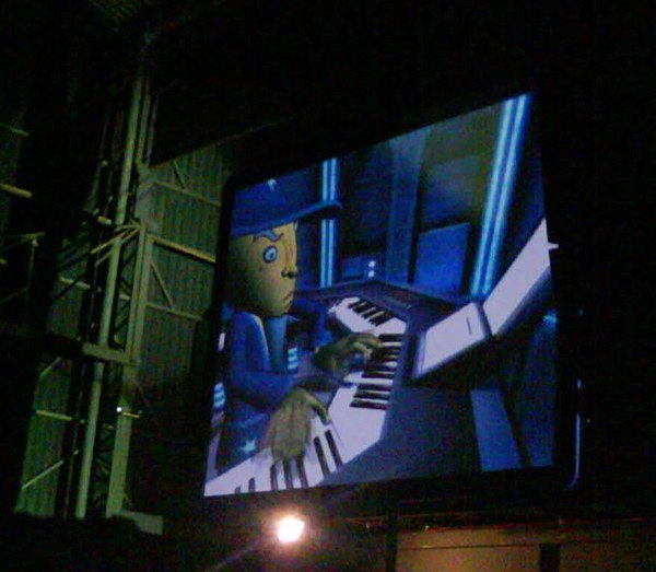 An automated virtual version of Jordan Rudess on a screen during a live performance in Porto Alegre, 2010