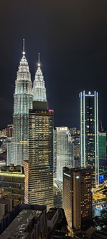 High-rise office blocks and hotels around Petronas Twin Towers, from left (directly in front of the Twin Towers) is Menara Carigali, Menara Maxis, Mandarin Oriental Hotel and Four Seasons Place Kuala Lumpur. KLCC and its surrounding.jpg