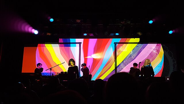 Ladytron performing in 2018; left to right: Peter Kelly, Mira Aroyo, Daniel Hunt, Reuben Wu, and Helen Marnie