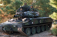 An armored crew from the 82nd Airborne Division, driving an M551A1 Sheridan light tank performing the opposing force role, takes time out at a nearby trail during their rotation at the Joint Readiness Training Center M551 Sheridan, Joint Readiness Training Center.JPEG