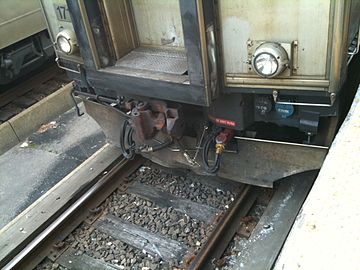 Janney AAR Type H coupler on MBTA EMU with separate power and control connections.