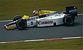 Nigel Mansell driving the FW10 at the 1985 German Grand Prix, in which he finished sixth.