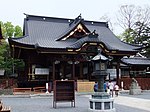 Wooden building with a hip roof.