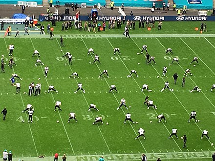 New Orleans Saints warm up on the Wembley pitch, complete with NFL markings, in 2017. Roy Hodgson, the England manager, complained of cut-up grass during the 2014 Series, while NFL markings still being visible during England's match with San Marino provoked negative media comment.