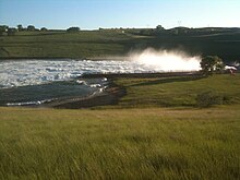 Oahe Dam release gates discharging floodwater at 150,000 cu ft/s (4,200 m/s) on June 15, 2011. Oahe Dam Flooding 061511.jpg