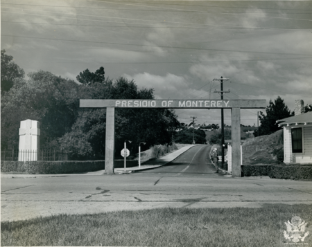 A sentry stands at the main gate to the Presidio of Monterey in the spring of 1945. The Presidio of Monterey was reactivated in January 1945 to accommodate the Civil Affairs Staging Area. Presidio Main Gate - Spring 1945.PNG