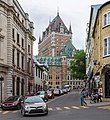 The Château Frontenac is located a block south of the building. The two are separated by Place d'Armes