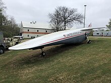 A newer design mockup on display at the Aviation Challenge campus of the U.S. Space & Rocket Center in Huntsville, Alabama; note the flat, duckbill nose and double-dorsal fin tail that distinguishes it from the older model. Rockwell X-30 Newer Design.png.jpg