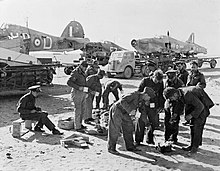 Personnel of No. 53 Repair and Salvage Unit in the Western Desert while transporting salvaged Hawker Hurricane fuselages to Helwan, Egypt during the Second World War. Royal Air Force Operations in the Middle East and North Africa, 1939-1943 CM2232.jpg