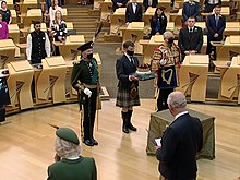 The Duke in the uniform of the Captain-General of the Royal Company of Archers in the Scottish Parliament, 2021 Scottish Parliament (Presentation of Crown) 2021.jpg