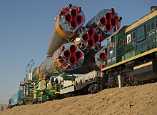 Transport of Soyuz rocket to pad by train Soyuz Rolls Out.jpg