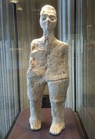 'Ain Ghazal statue; circa 7th millennium BC; Louvre (Paris). The 'Ain Ghazal Statues consist of a framework of twine-tied reeds coverd with plaster. Some are plain; others have painted bands on their faces and bodies, perhaps representing clothing. Some are full-length, around 90 cm. (36 in.) heigh; others are simply armless torsos. Many are gender-neutral; others clearly female