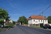 Strážky, hlavní ulice s autobusovou zastávkou