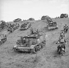 Universal Carriers and motorcycles of the 1/4th Battalion, Welch Regiment, on manoeuvres at Keady in County Armagh, Northern Ireland, 22 July 1941. The British Army in the United Kingdom 1939-45 H11968.jpg