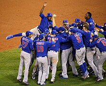 The Cubs celebrate after winning the 2016 World Series. (30114597354).jpg