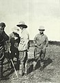 Theodore Roosevelt in Africa, inspecting camera with Richard John Cuninghame (left) and Kermit Roosevelt (center).jpg