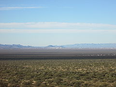"A" Mountain (right) and Tumamoc Hill (left) in the distance, looking west across the Tucson Valley