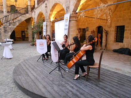 Members of the Lefkoşa Municipal Orchestra performing in Büyük Han
