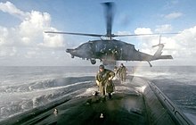 A MH-60L from 160th SOAR deploys an ODA from 7th SFG(A) on board a U.S. submarine for a joint exercise US Army 160th SOAR deploy 7th SFG to US submarine.jpg