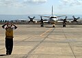 US Navy 060823-N-3013W-003 Aviation Ordnanceman 3rd Class Giancarlo Rosasarias of Los Angeles, Calif., directs the taxi pilot to straighten his direction of movement in order to properly park a P-3C Orion, after returning from.jpg