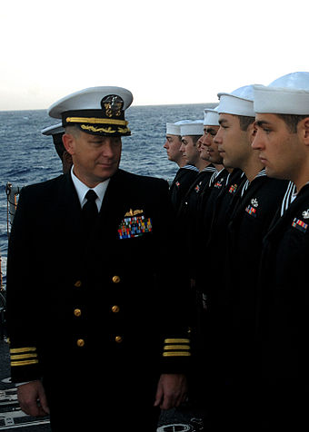 An officer inspects enlisted sailors in Service Dress Blue (2008)