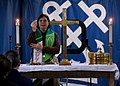 US Navy 080615-N-1281H-130 Chaplain Lt. Barbara Wood partakes in communion during a Sunday morning service aboard Nimitz-class USS Abraham Lincoln (CVN 72).jpg