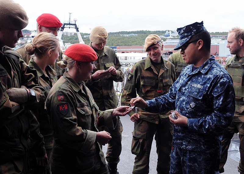 File:US Navy 110830-N-ON468-044 Ship's Serviceman Seaman Apprentice Ulises Hernandez hands out command coins from the guided-missile frigate USS Carr (F.jpg
