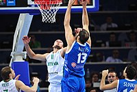 Kosta Koufos (#13 in blue), with the senior Greek NT. Valanciunas against Koufos.jpg