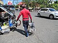 Walking Baliwagenyo Peddler with assorted products in Baliuag