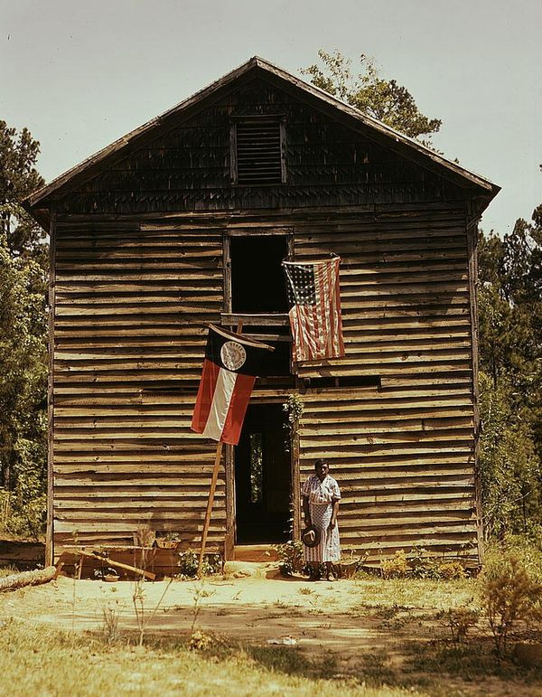 Georgia and United States flags on the side of a building near White Plains, c. 1941.